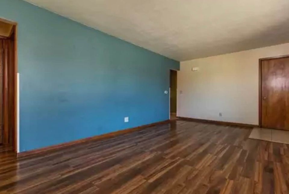 Dining area at Woodlawn with a large window providing natural light and a sophisticated design.