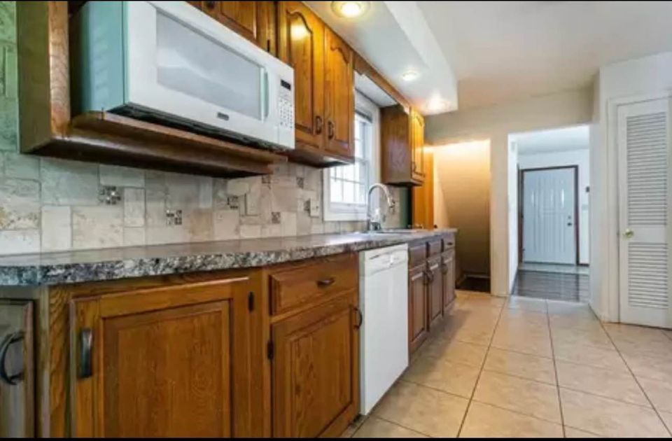 Additional angle of the renovated Woodlawn kitchen emphasizing spaciousness and efficient design.