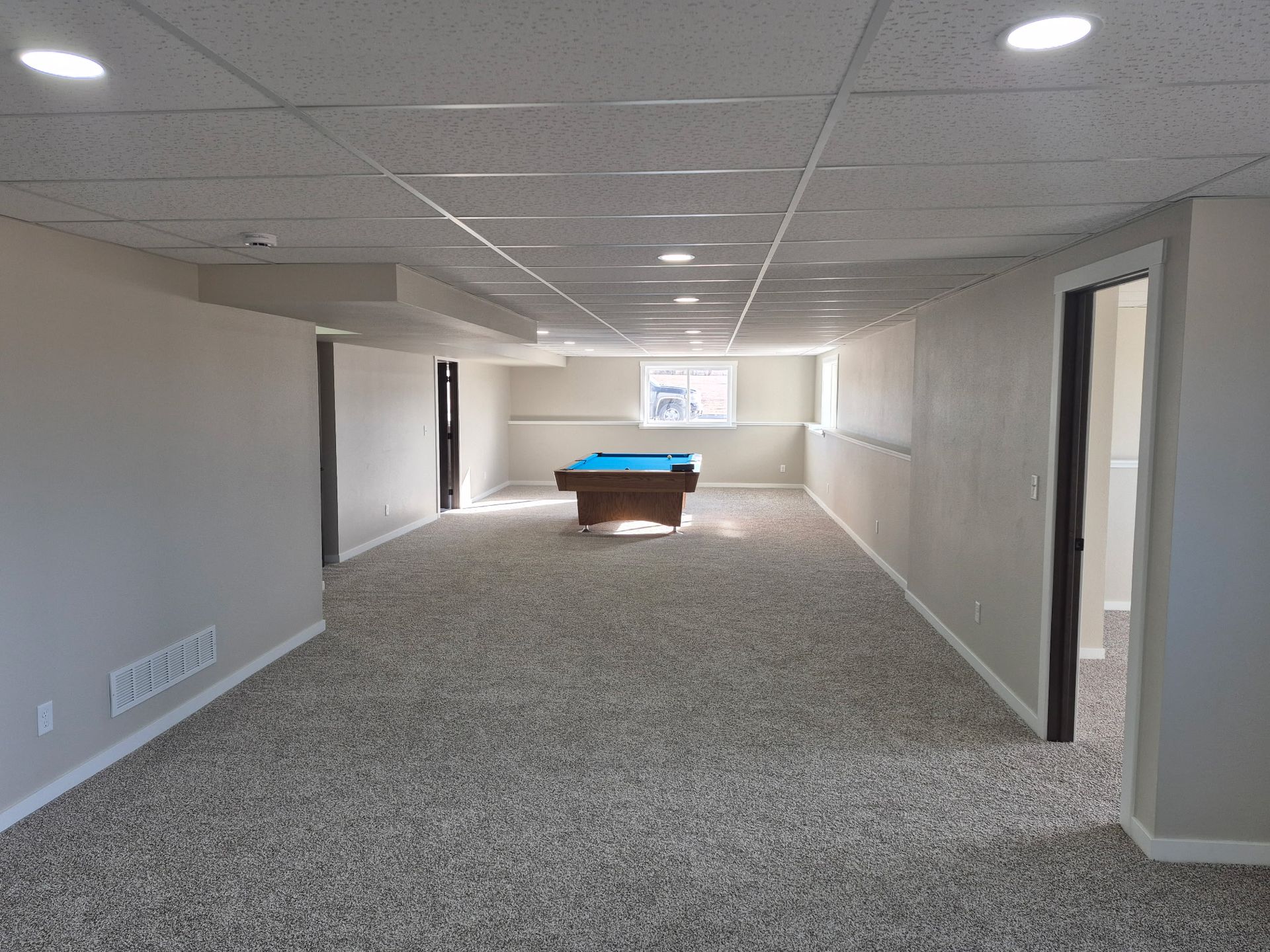 Newly finished basement with plenty of room for activities. 