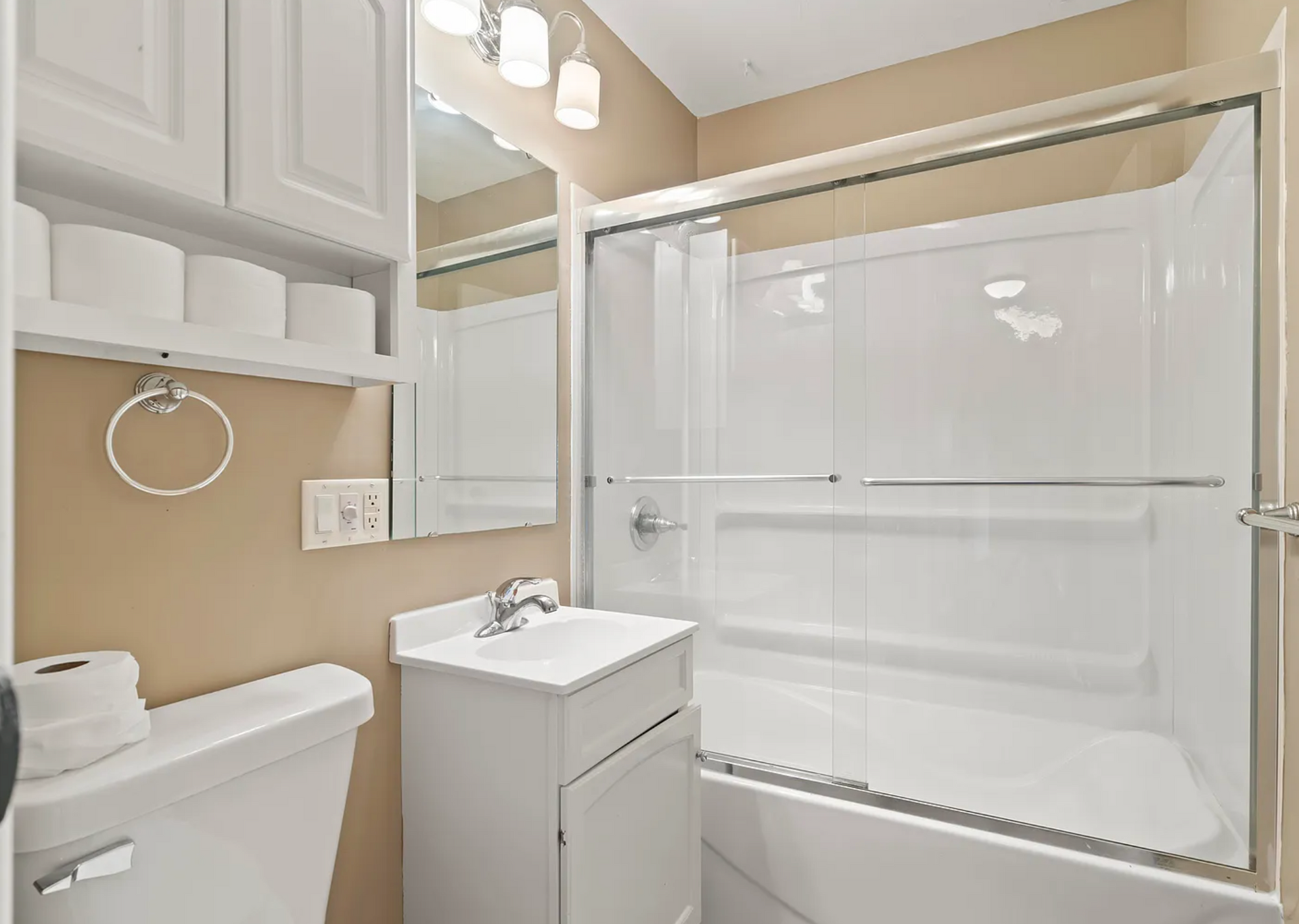Beautifully designed bathroom with modern fixtures, sleek tile work, and a spacious shower at Kane St.