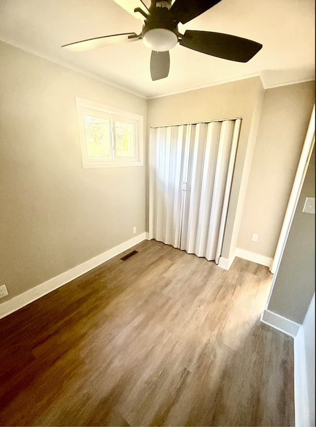 Third bedroom in remodeled Dubuque home with modern updates