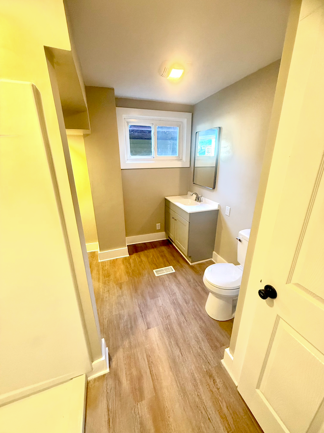 Second bathroom with walk-in shower and updated plumbing fixtures