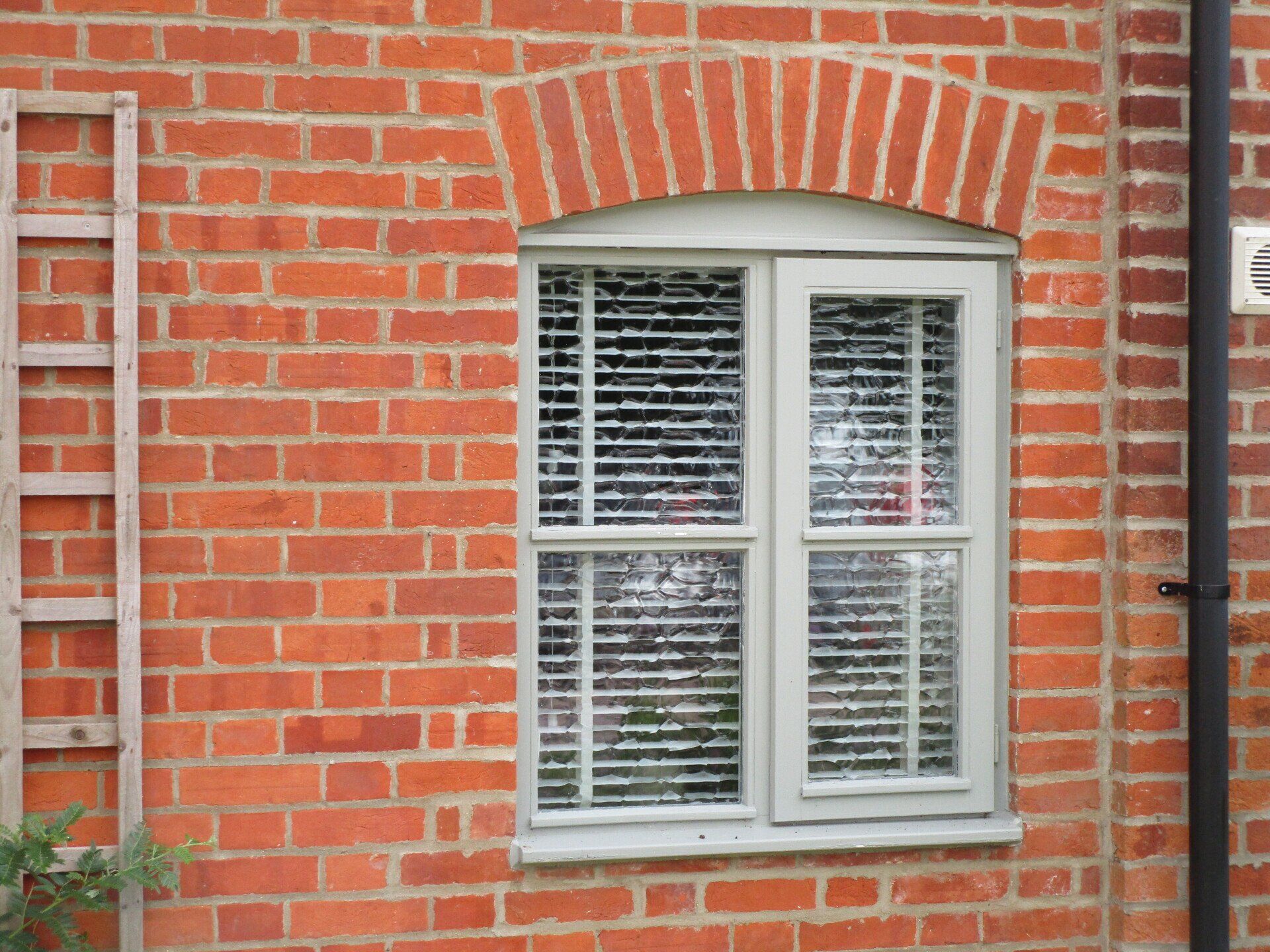 New UPVC Window with French Grey paint on the outside, white wood grain on the inside including Georgian bars and the Heritage Flush System