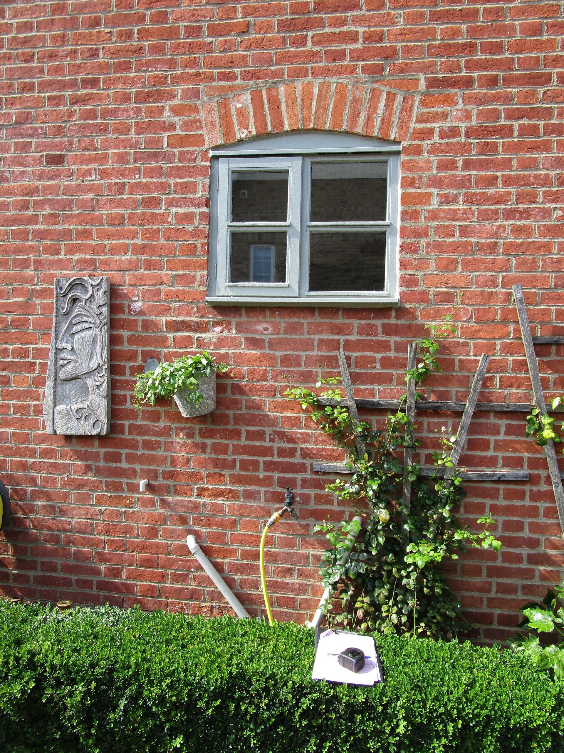 New UPVC Window with French Grey paint on the outside, white wood grain on the inside