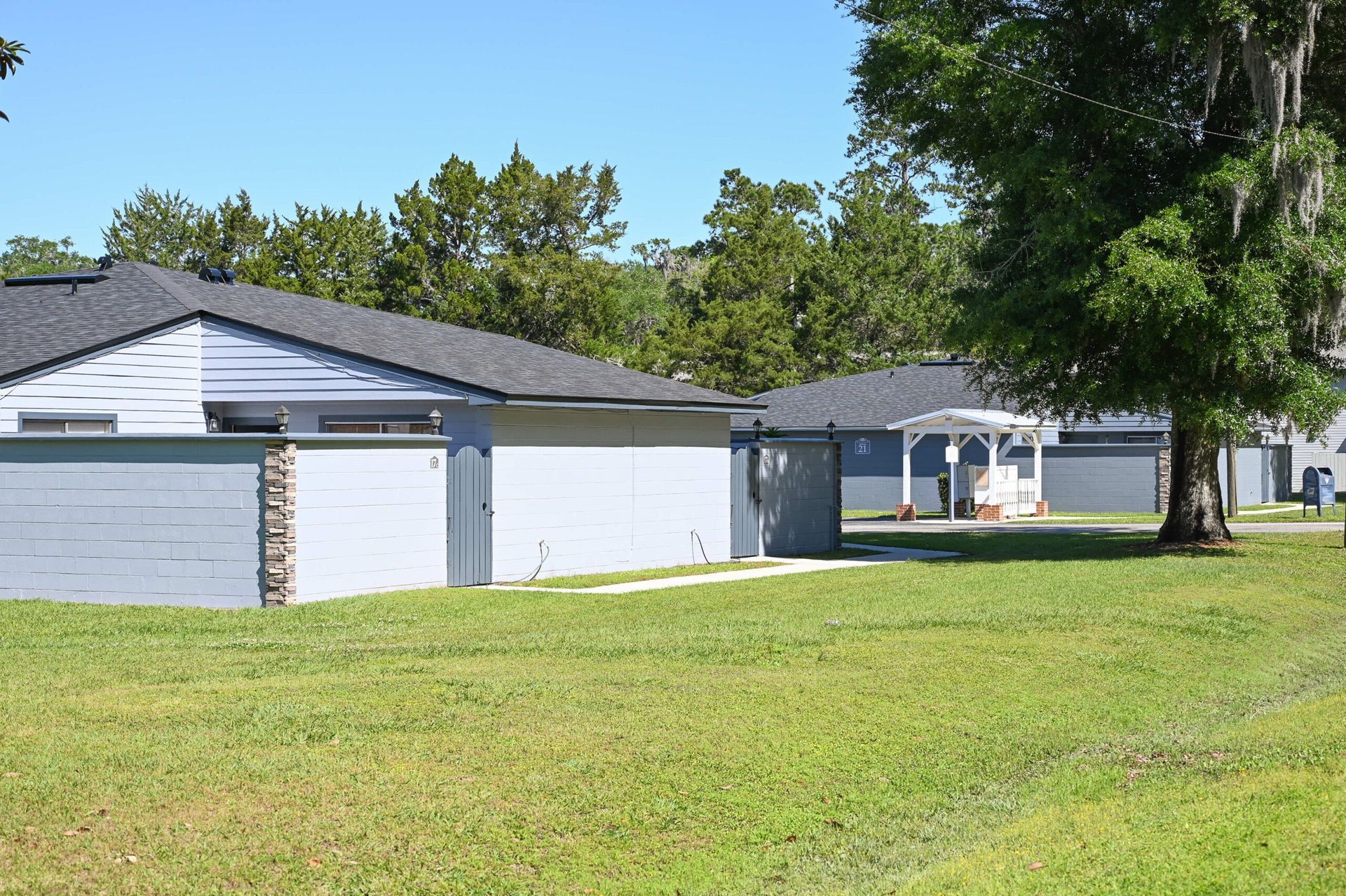 Photo of an apartment community with single-story buildings spread throughout