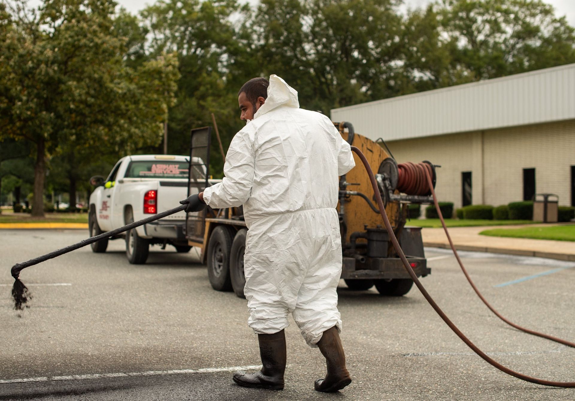 Hand Touching a Crack on Asphalt — Pikefield, NC — Asphalt Services of Goldsboro