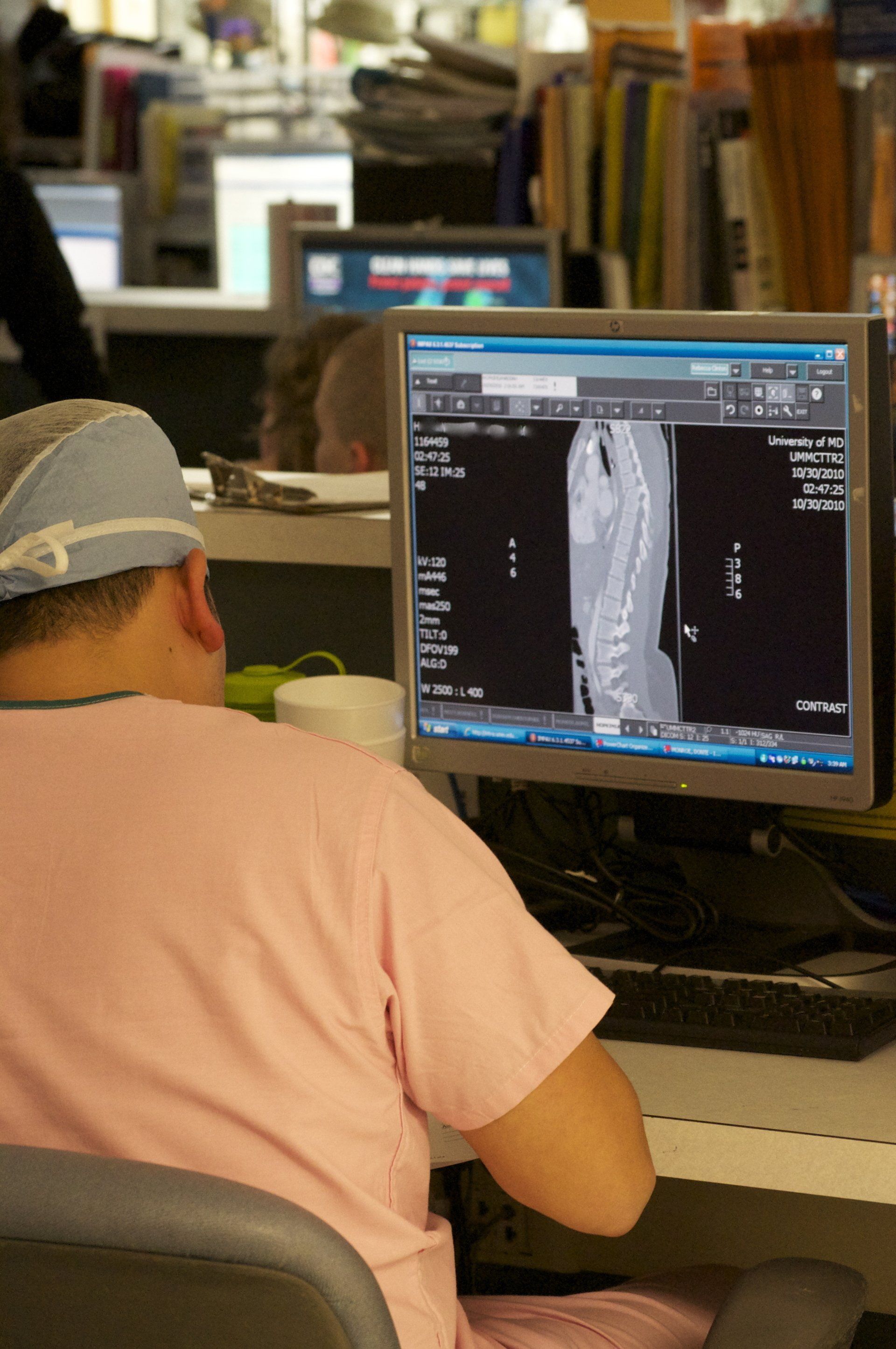 Medical professional checking monitor