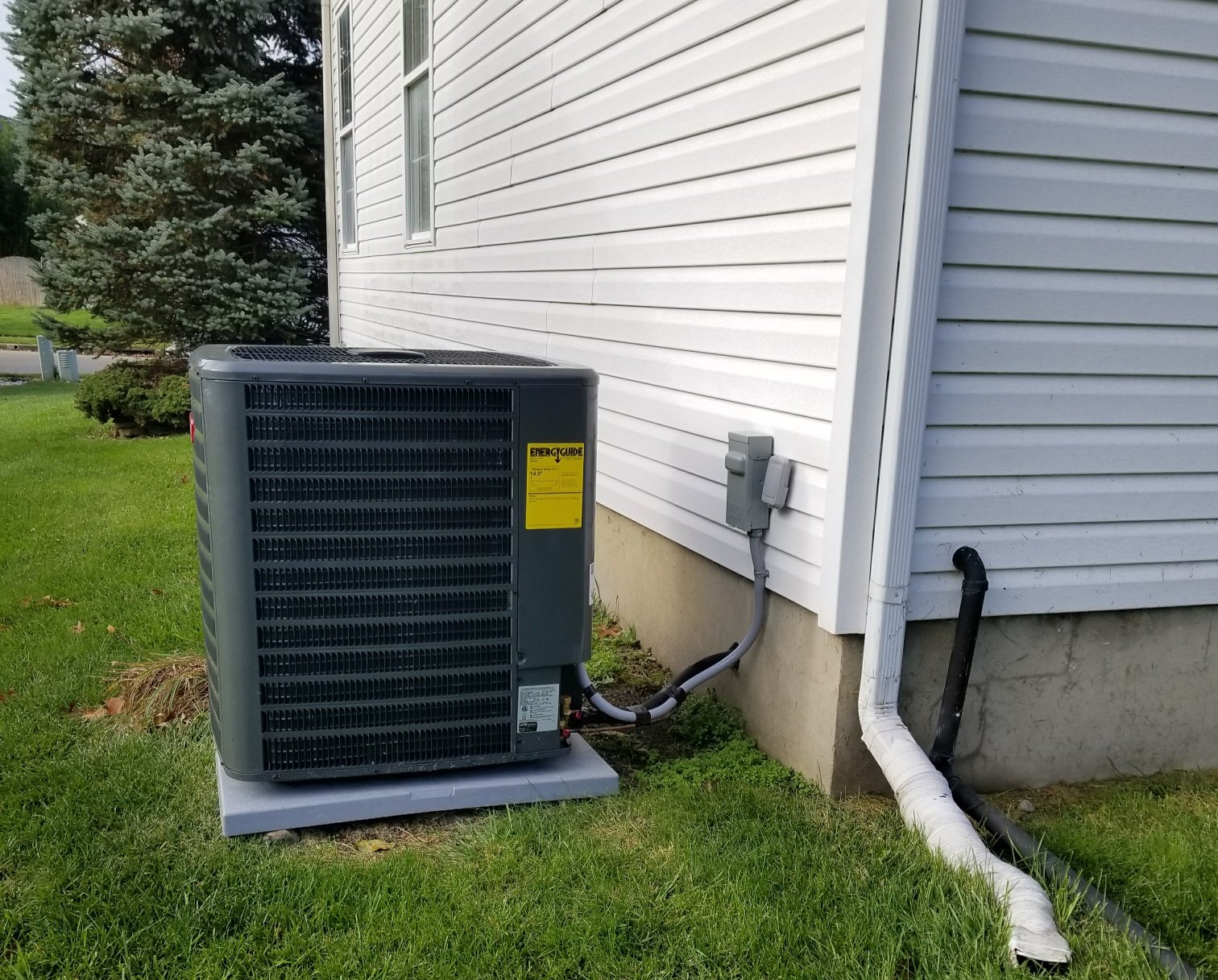 Outdoor Air Conditioning unit next to a house