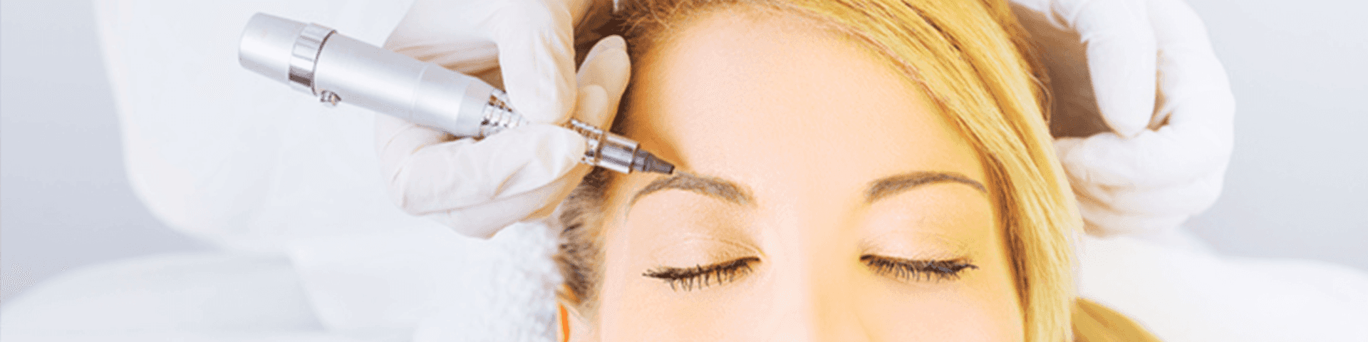 Woman receiving eyebrow treatment from day spa