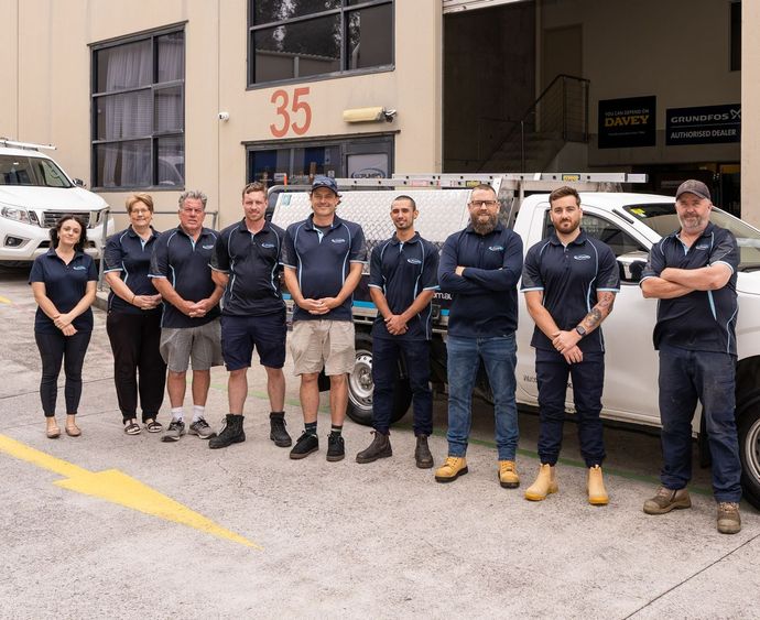 The SC Pumps team posing for a picture in front of the workshop in Moorebank
