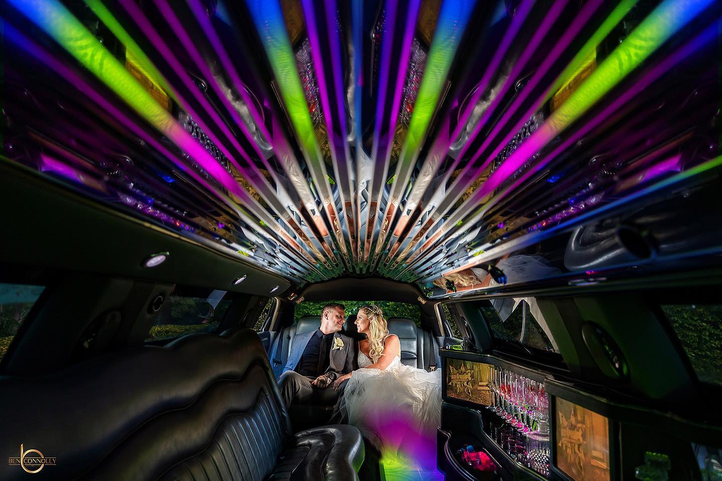 Couple Having A Wine Inside The Limousine — Superstretch300 Limousines in Golden Beach, QLD