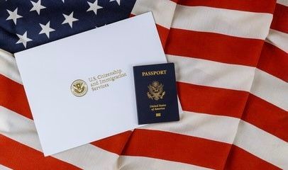 U.S. passport and document on American flag.