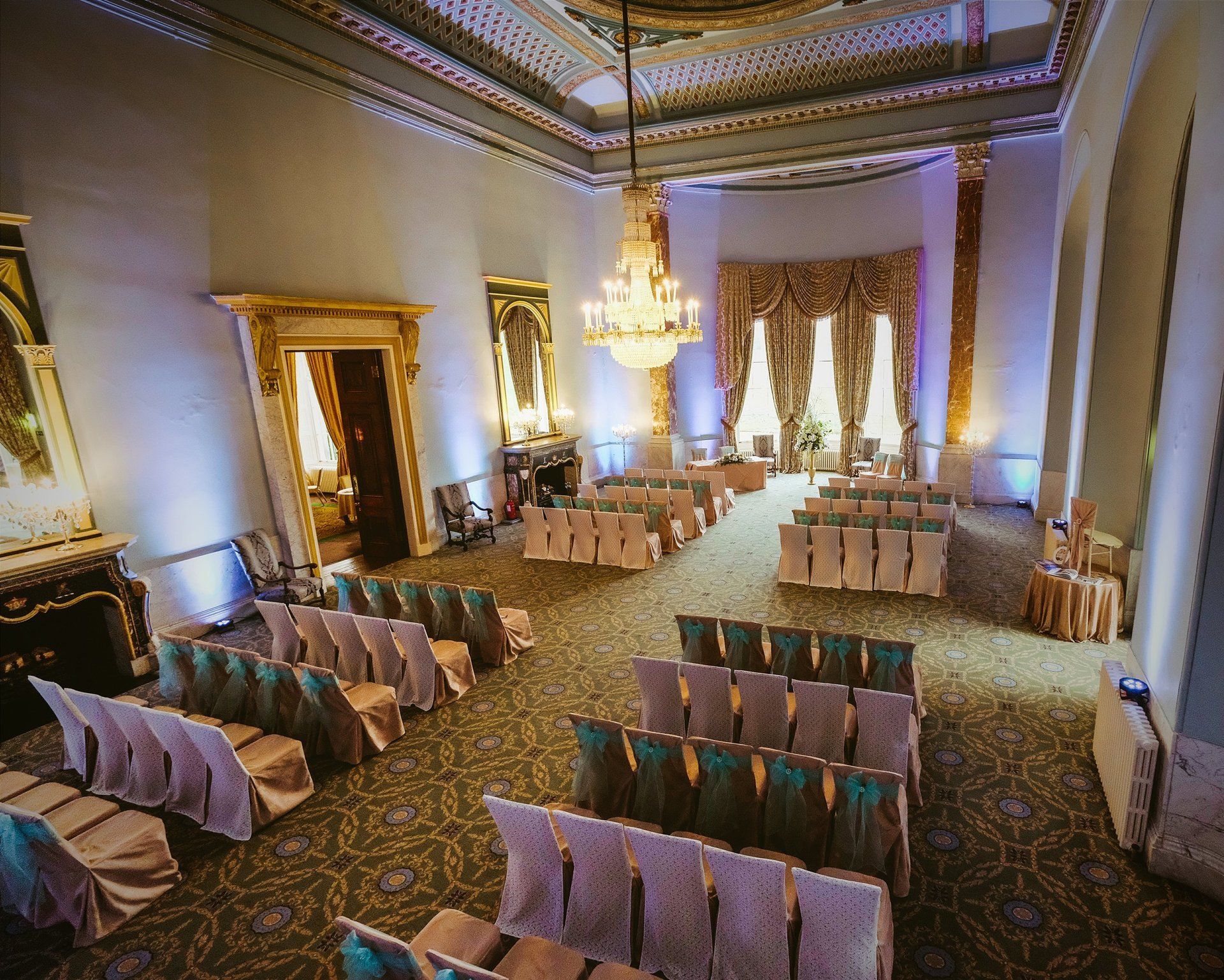 White uplighting in the Ballroom at Wynyard Hall