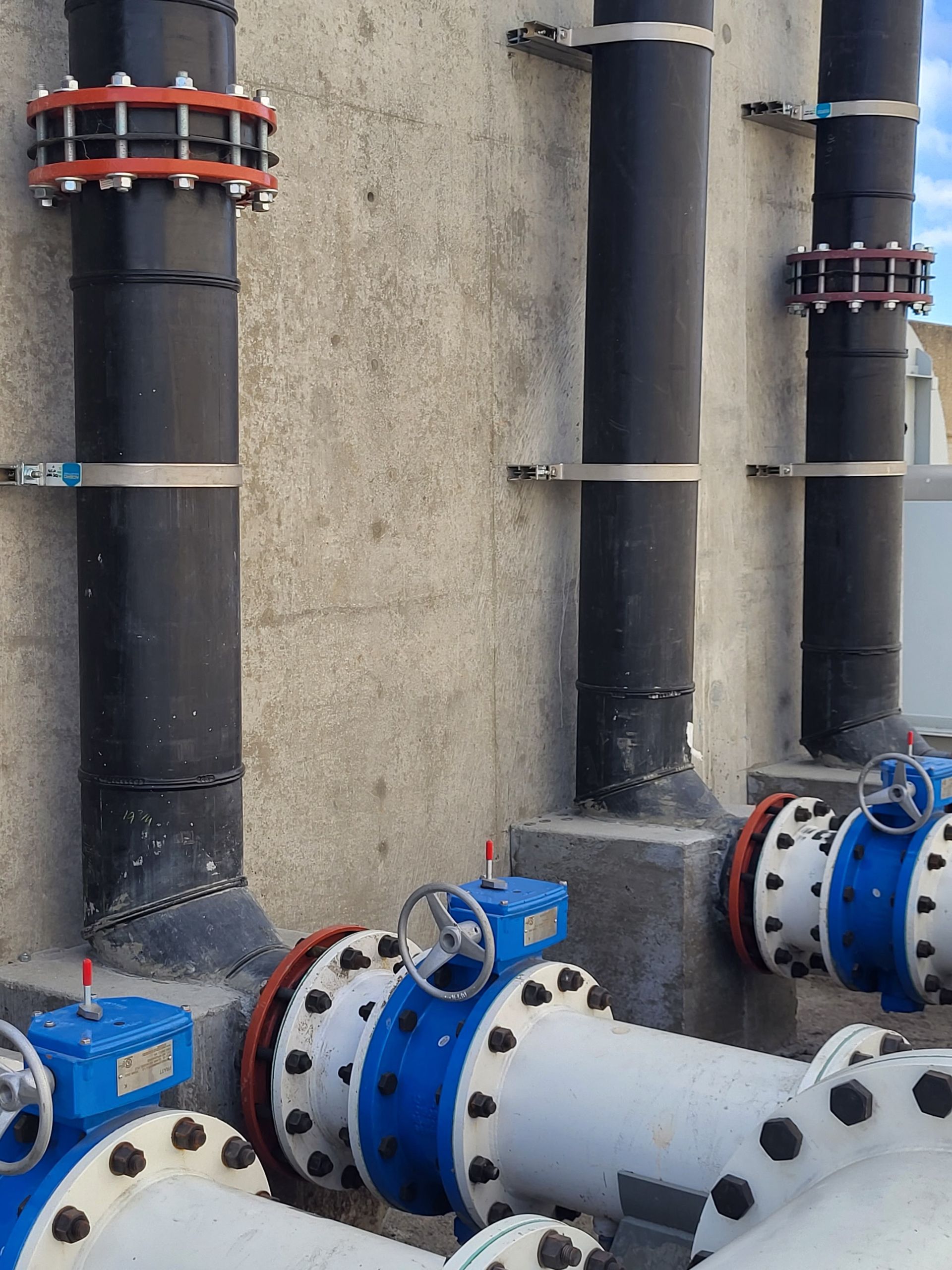  5D Company llc a bunch of pipes are lined up against a wall