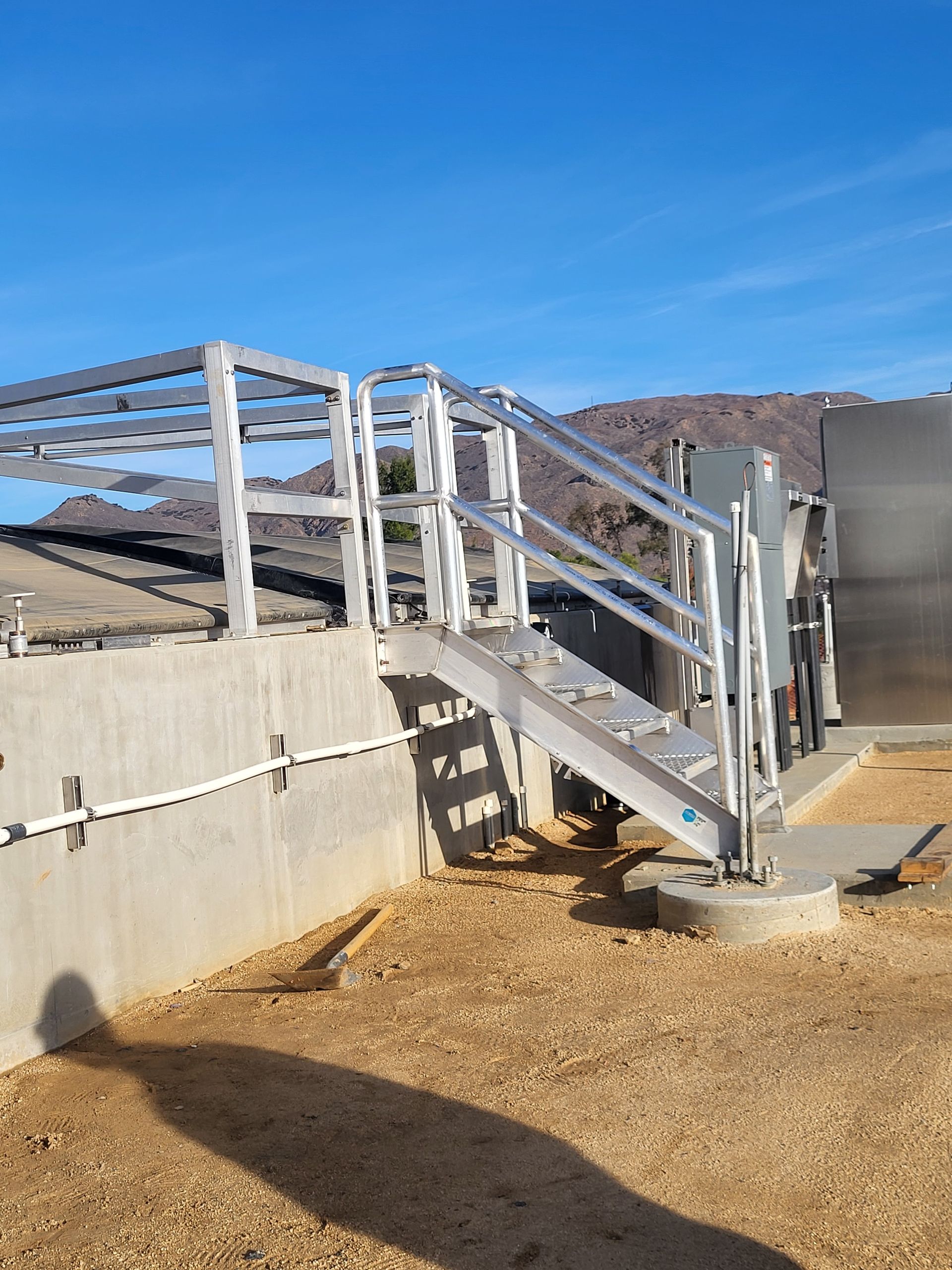  5D Company llc a set of stairs leading up to a building with a railing .