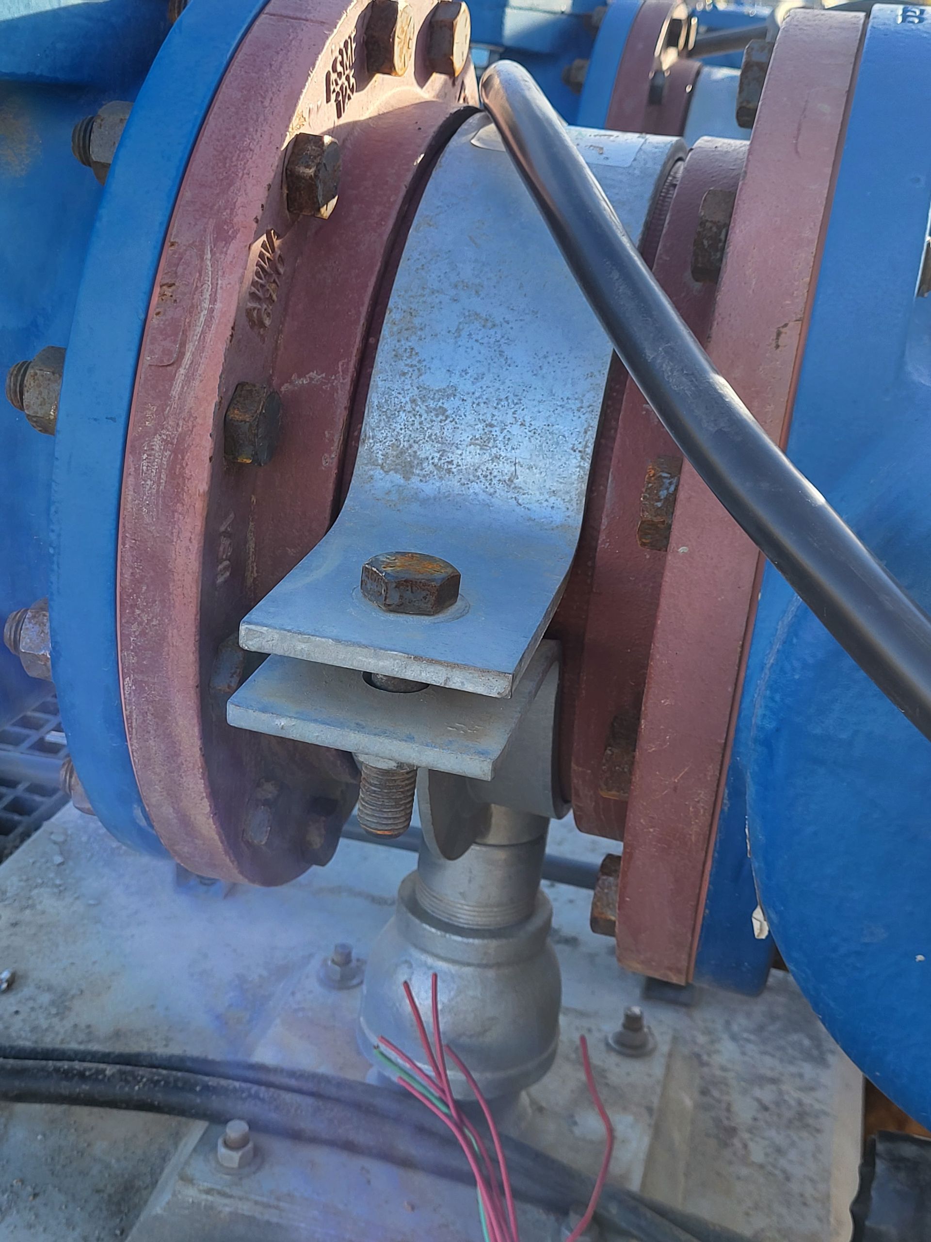  5D Company llc a close up of a pipe with a cable attached to it