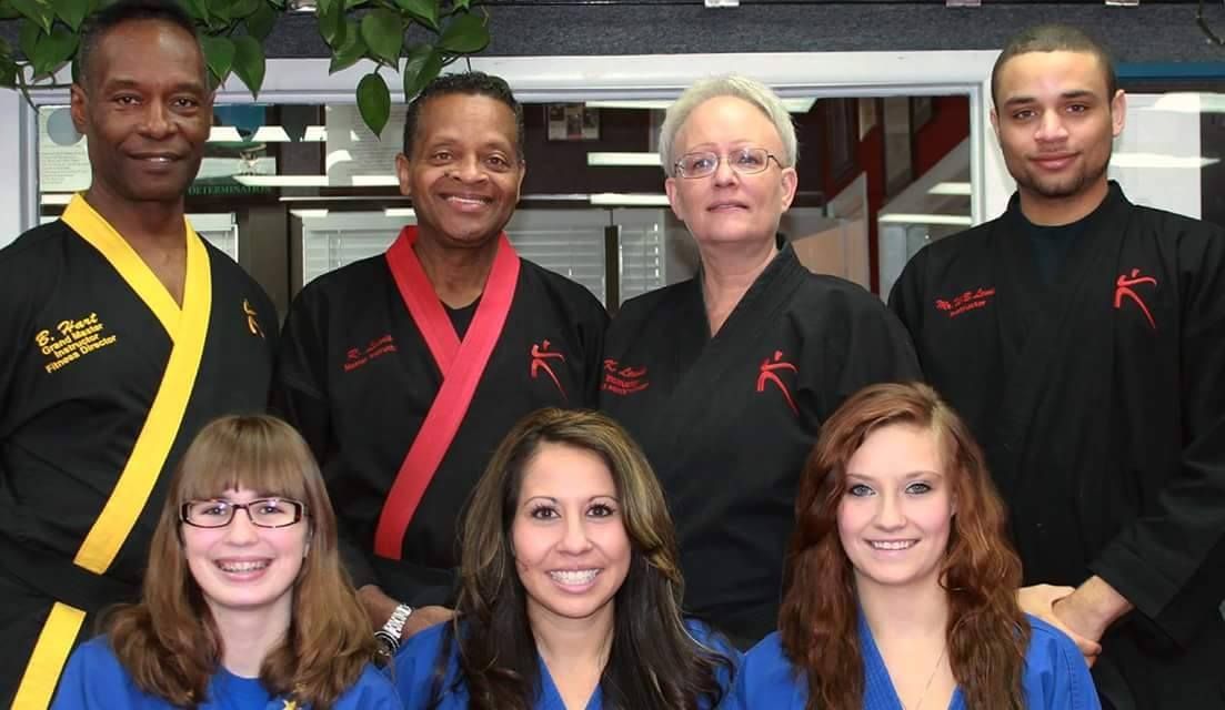 A group of people are posing for a picture together