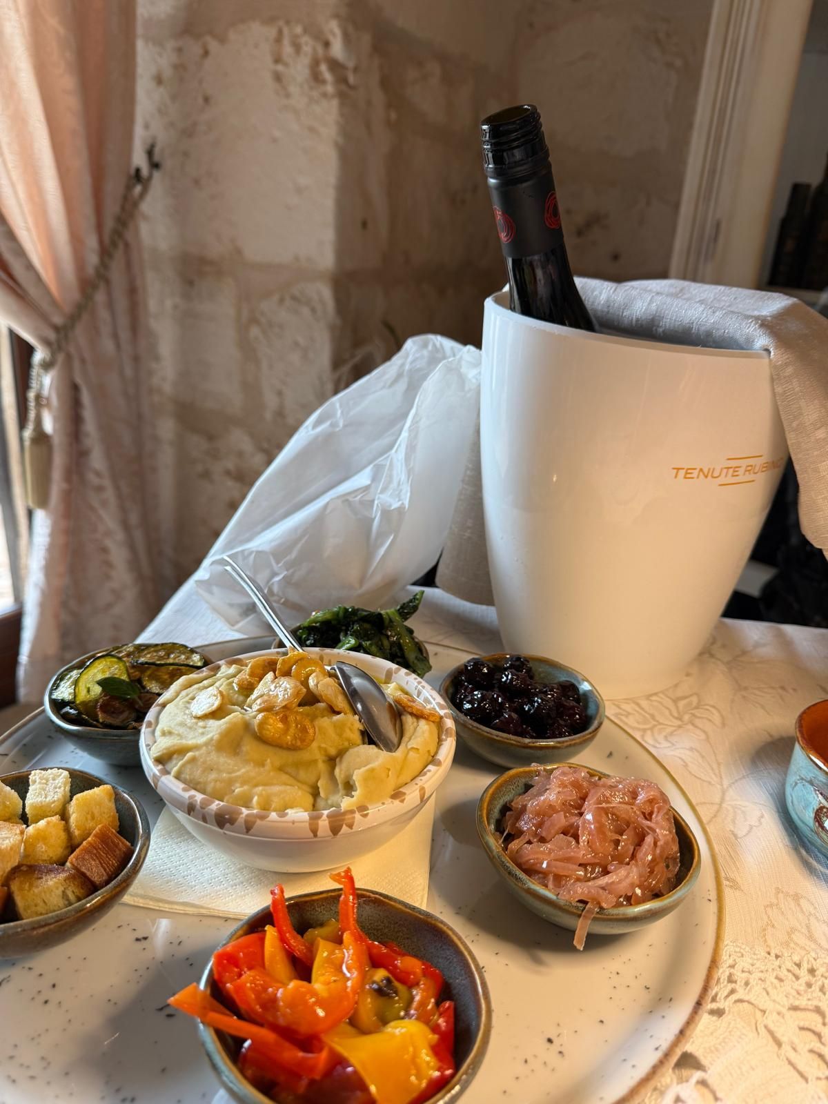 couple tasting traditional food in puglia with local hosts