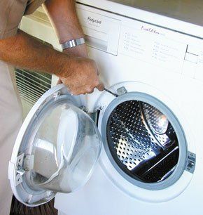 Man fixing a washing machine