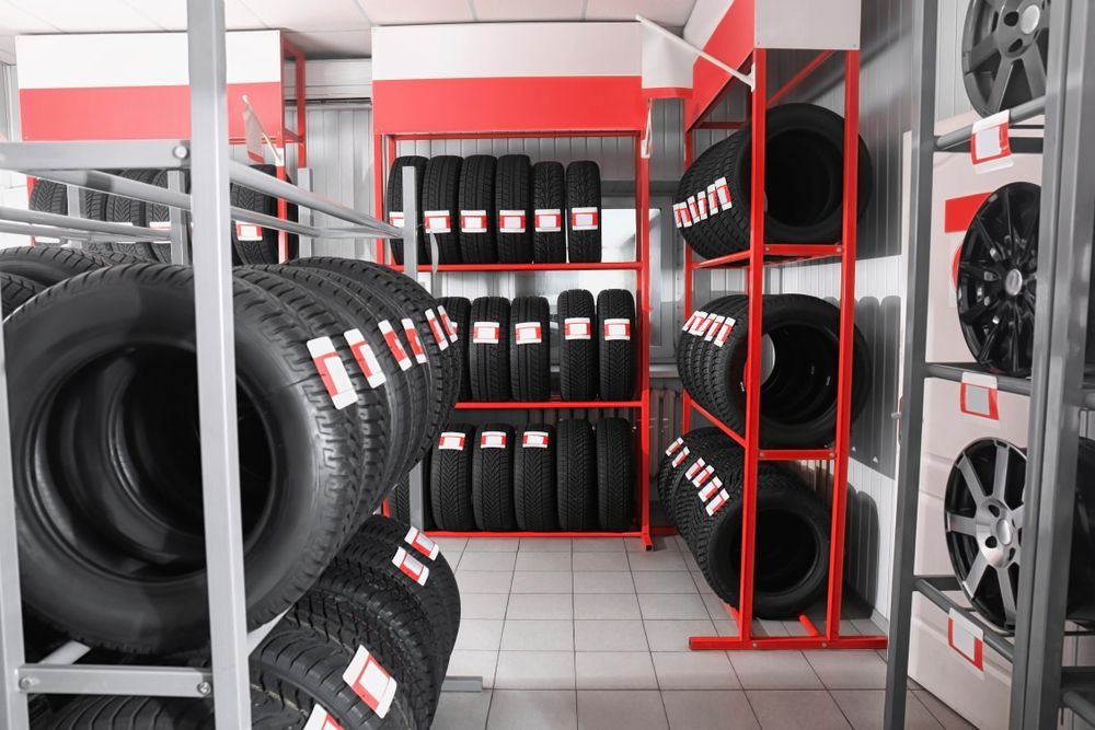 Tires Displayed on Metal Racks Inside a Shop — Innisfail Pro Motors in Tully, QLD