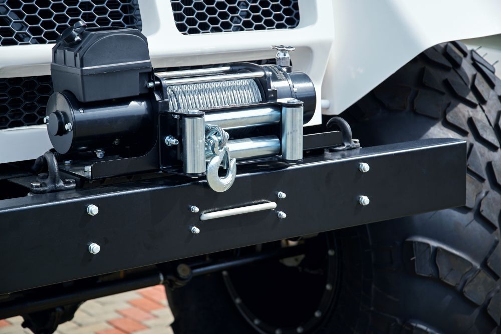 Black Winch Mounted on a Black Bumper of a White Off-road Vehicle — Innisfail Pro Motors in Innisfail, QLD