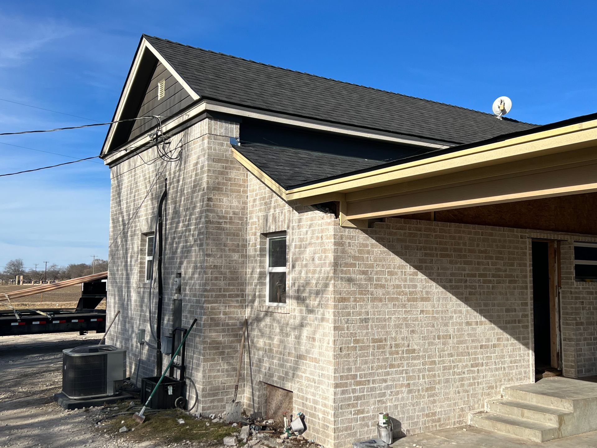 A brick building with a satellite dish on top of it
