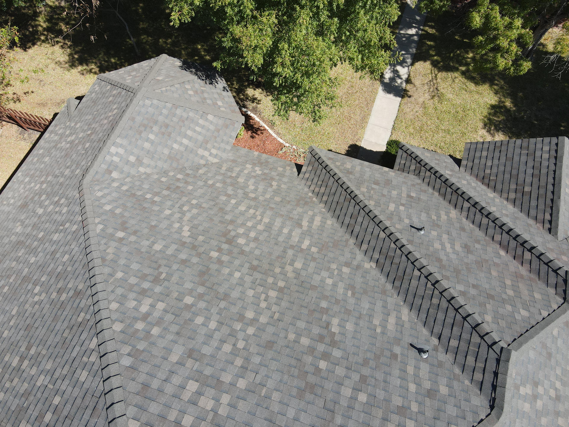 An aerial view of a roof of a house with a lot of shingles.