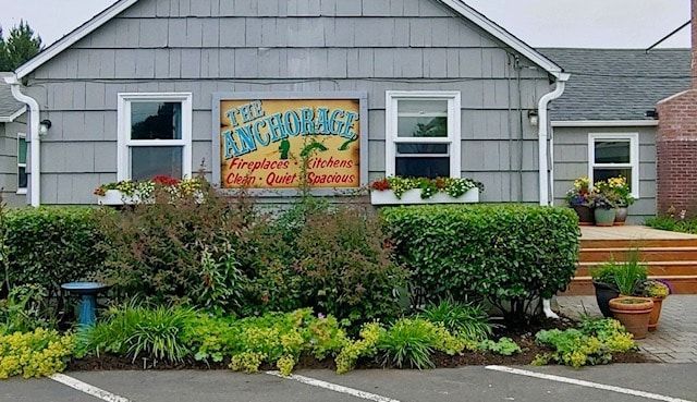 A house with a sign that says ' the anchorage ' on it