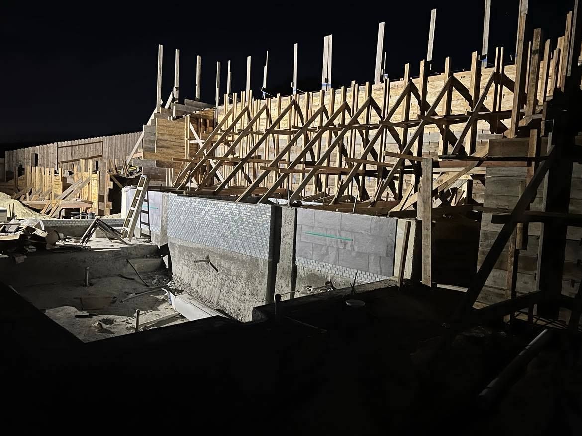 WEST VILLAGE CONCRETE RETAINING WALL FRAMING NIGHT