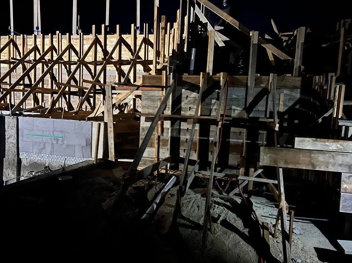 WEST VILLAGE CONCRETE RETAINING WALL FRAMING NIGHT