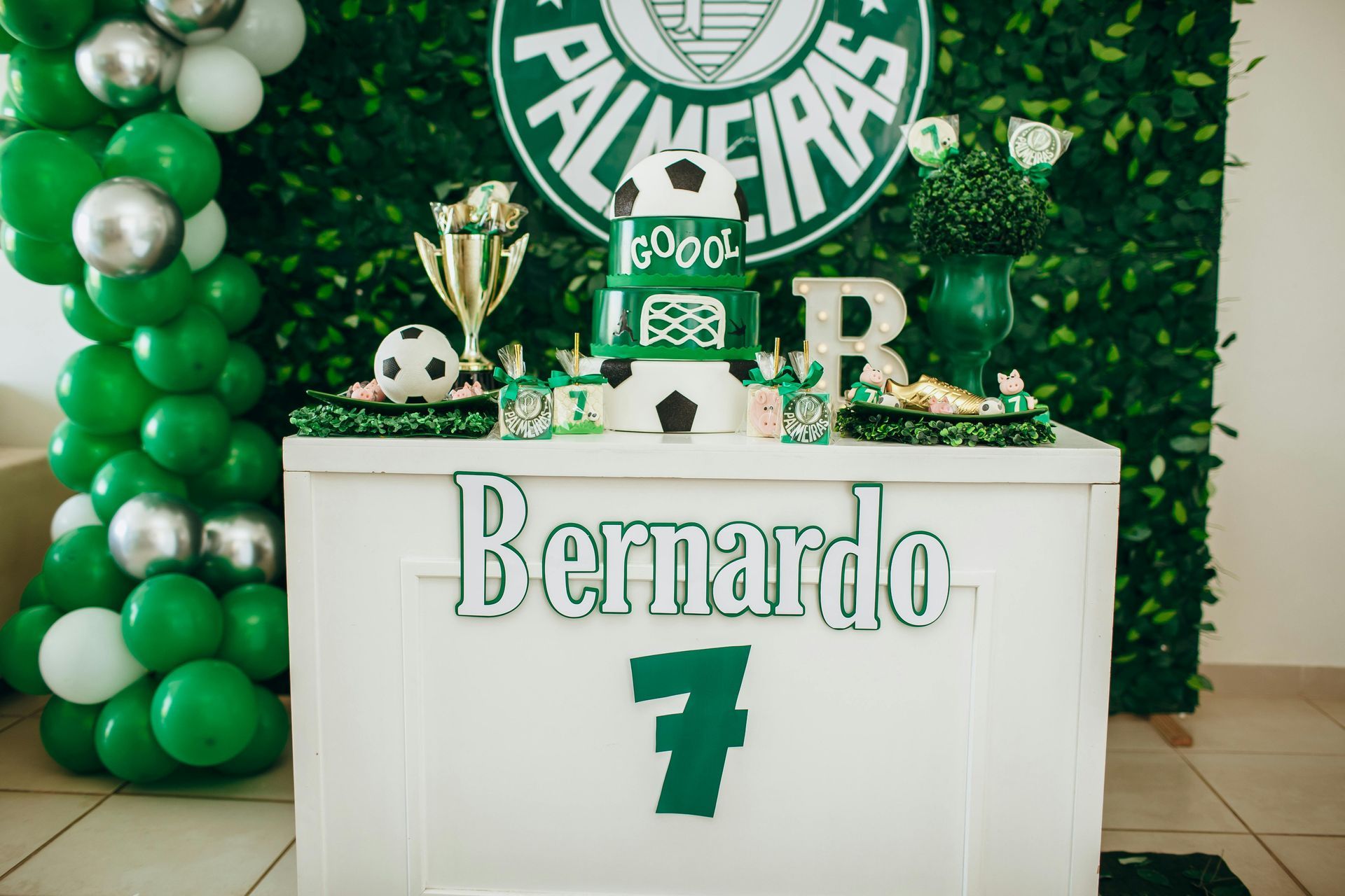 Party table with green and white decorations, celebrating