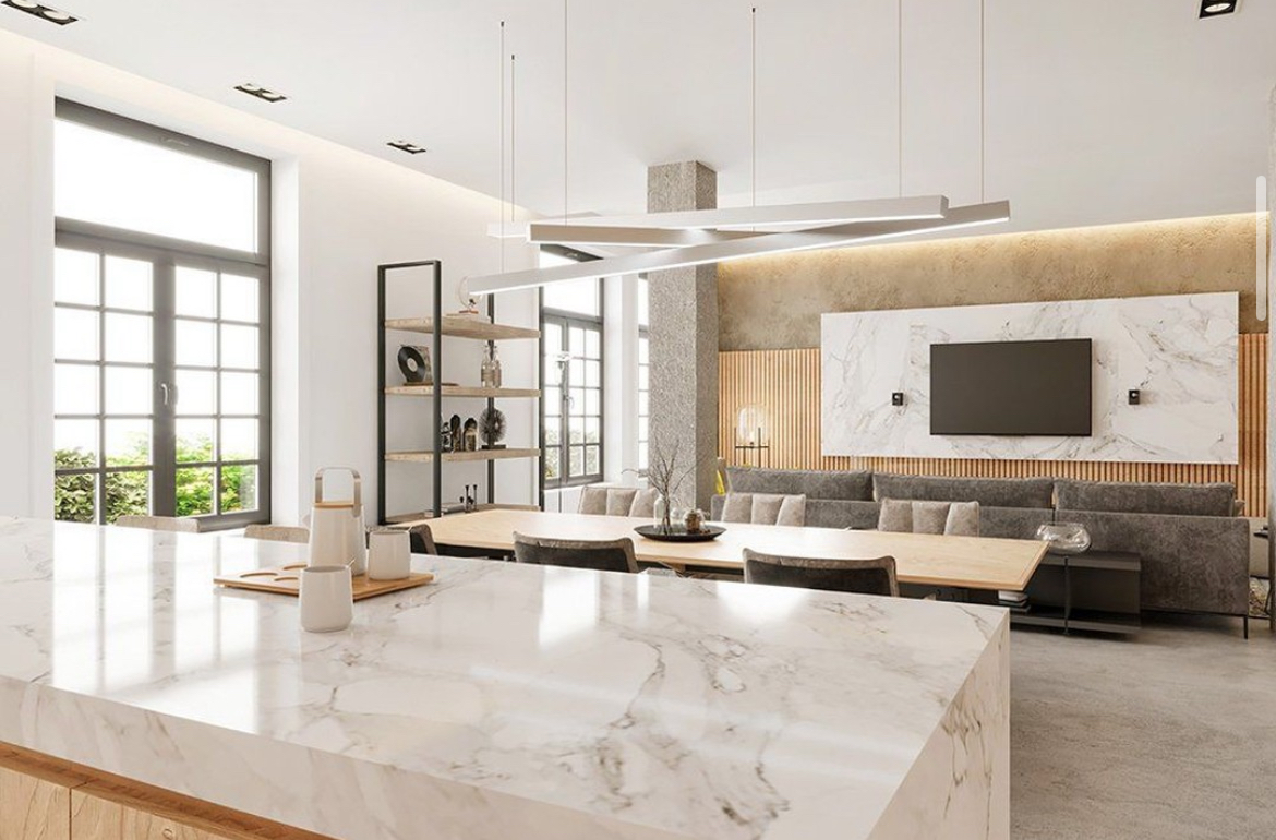 Porcelain countertops with a subtle veining pattern in a minimalist kitchen.