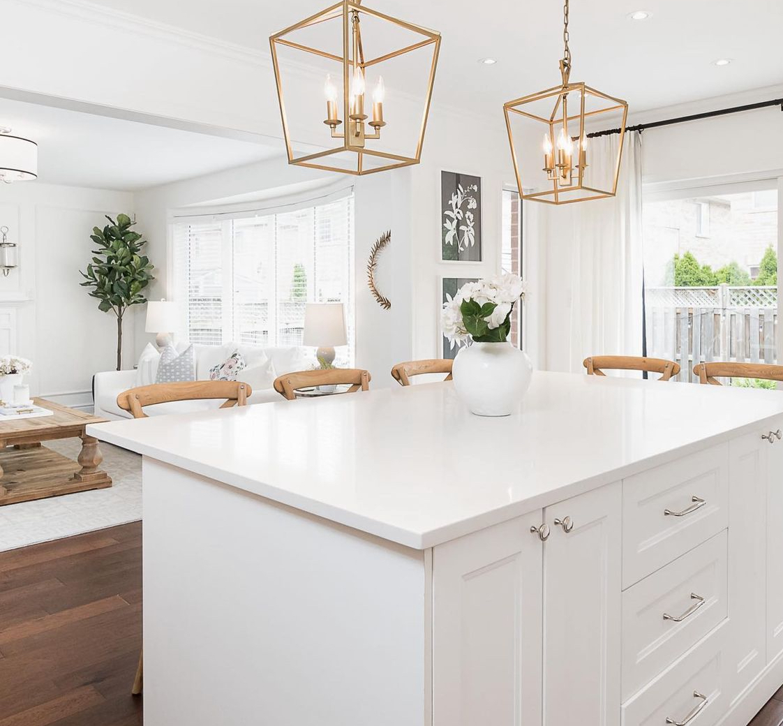 White quartz countertops in a modern all white kitchen.