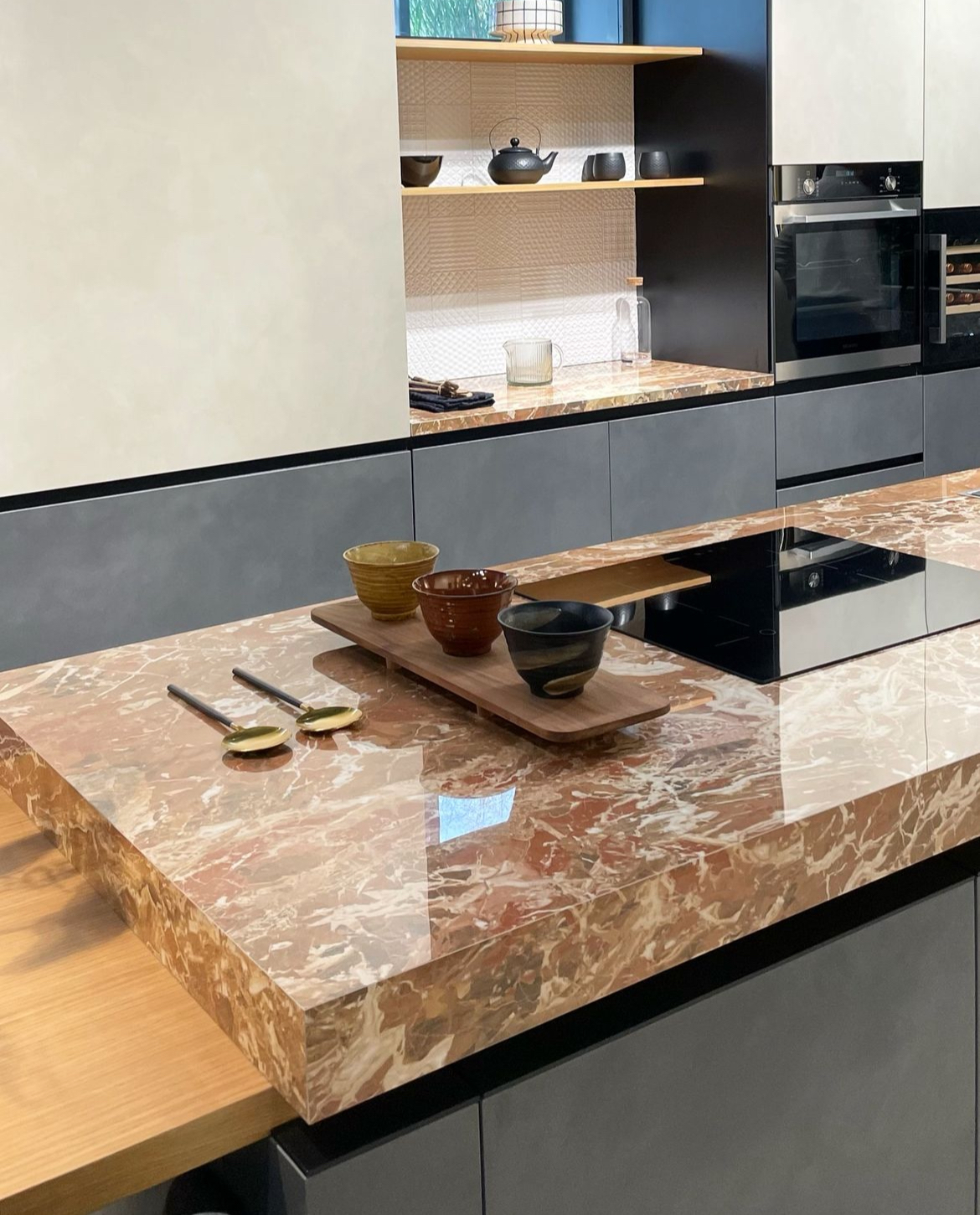 Porcelain countertops with a marble look in a high-contrast kitchen.