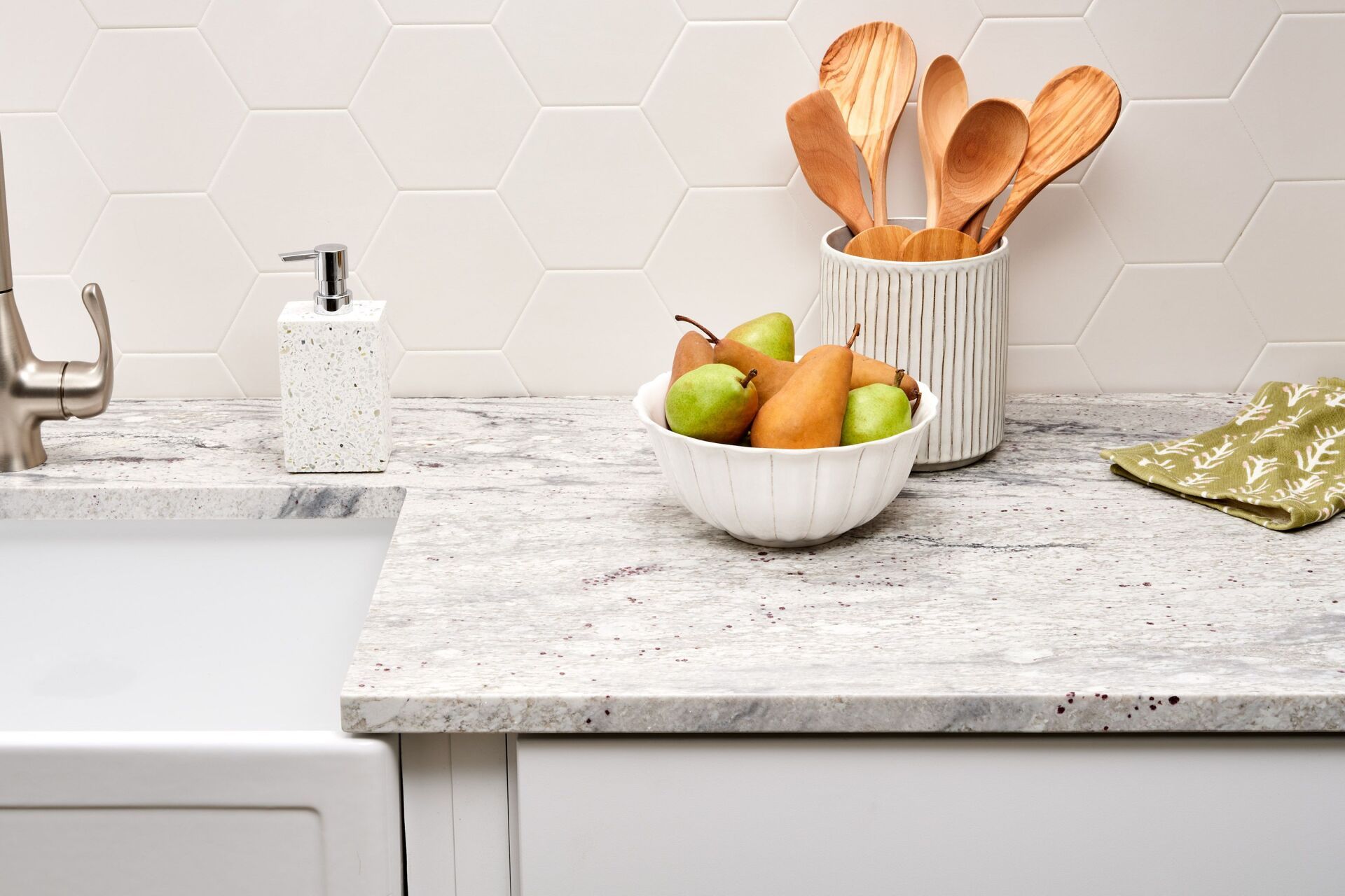 Rustic quartz kitchen countertop nicely paired with an apron sink.