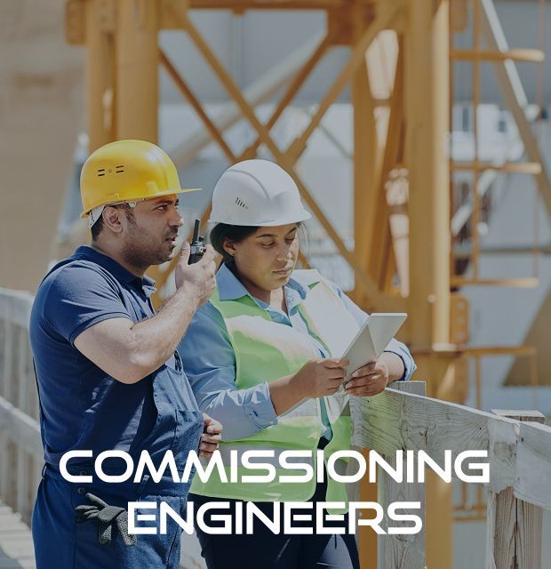 A man and a woman are looking at a tablet with the words commissioning engineers below them