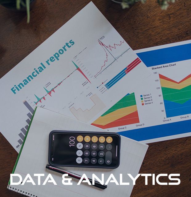 Financial reports and a calculator on a table with the words data & analytics