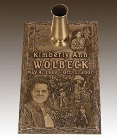 a bronze grave marker for kimberly ann wolbeck