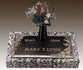 a gravestone for mary p. lynn with a vase of flowers on it .