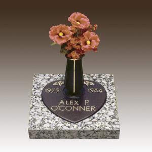 a gravestone for alex p. o'conner with flowers in a vase