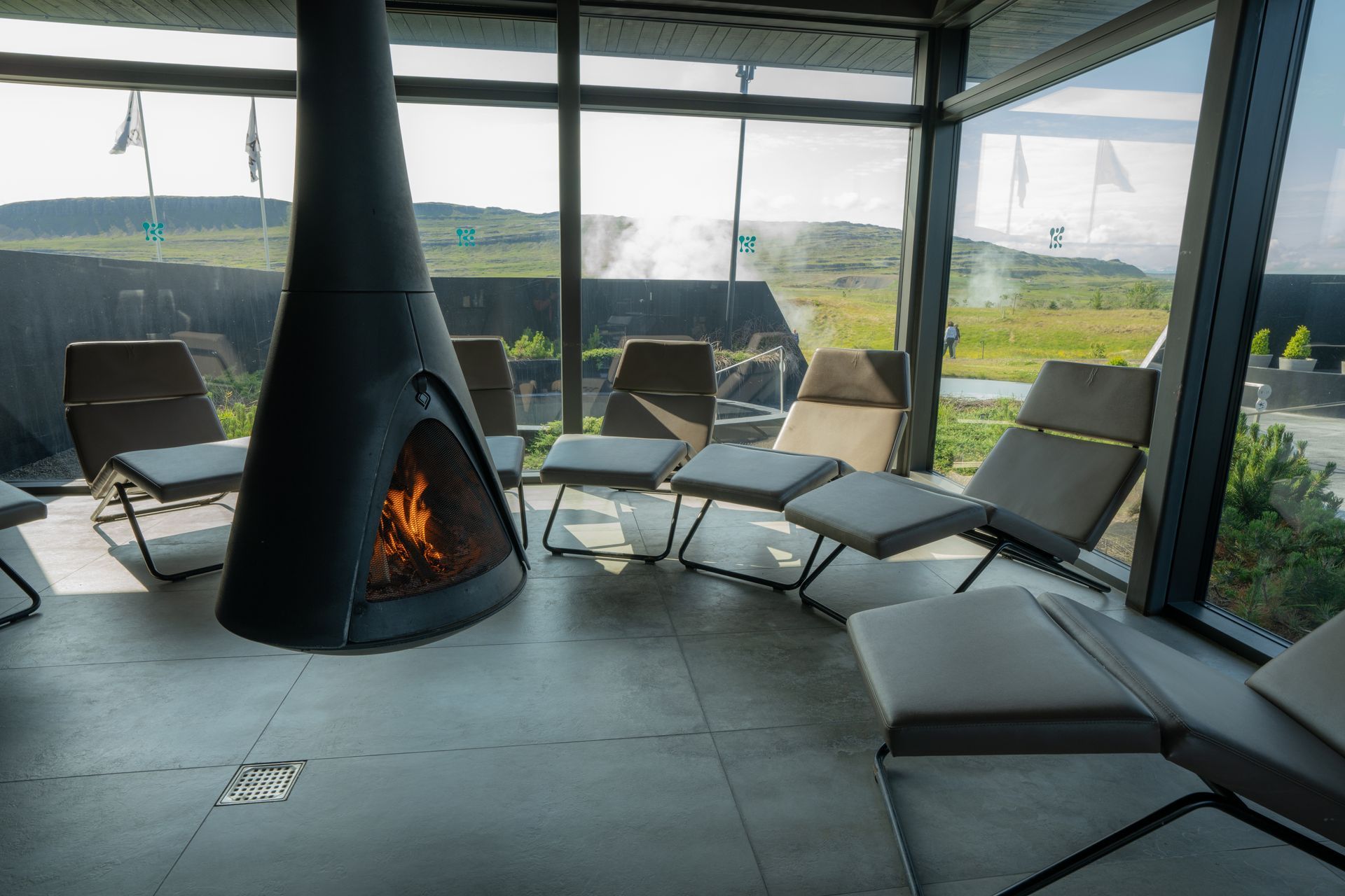 the relaxation room at krauma geothermal, with the pools in the background