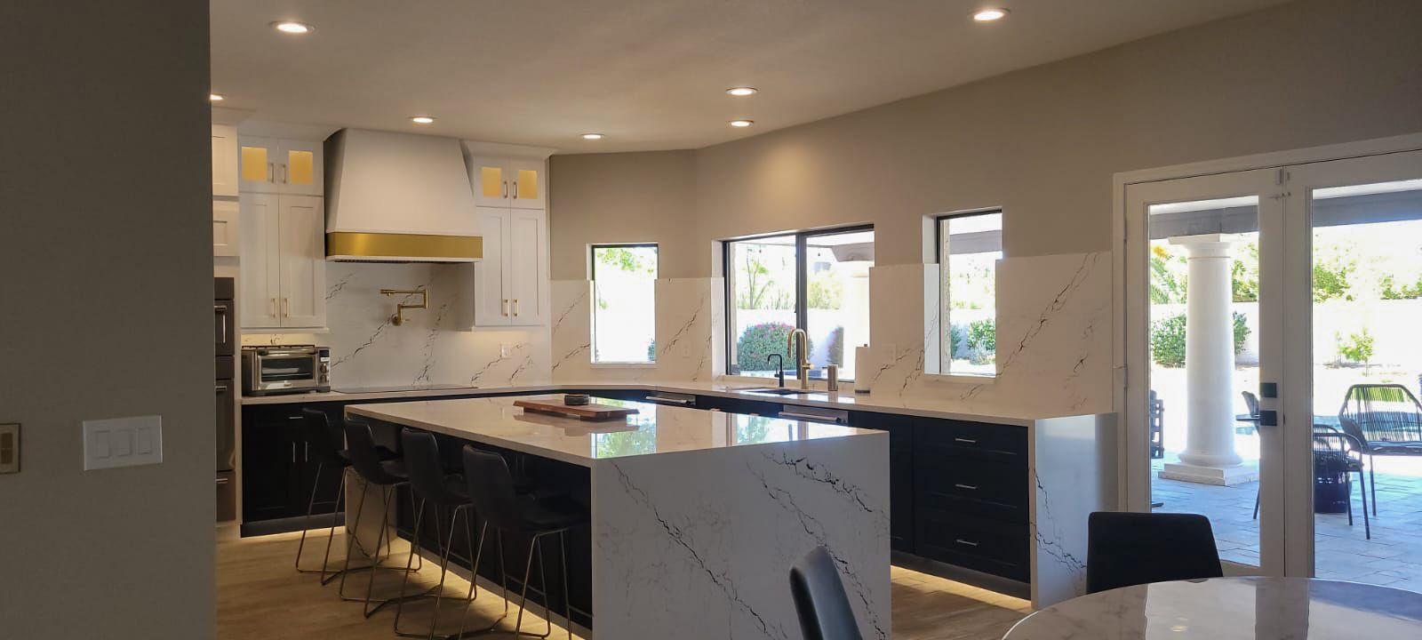 There is a large island in the middle of the kitchen.