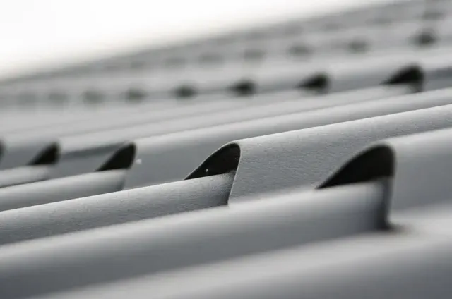 A gutter guard installed on a residential roof.