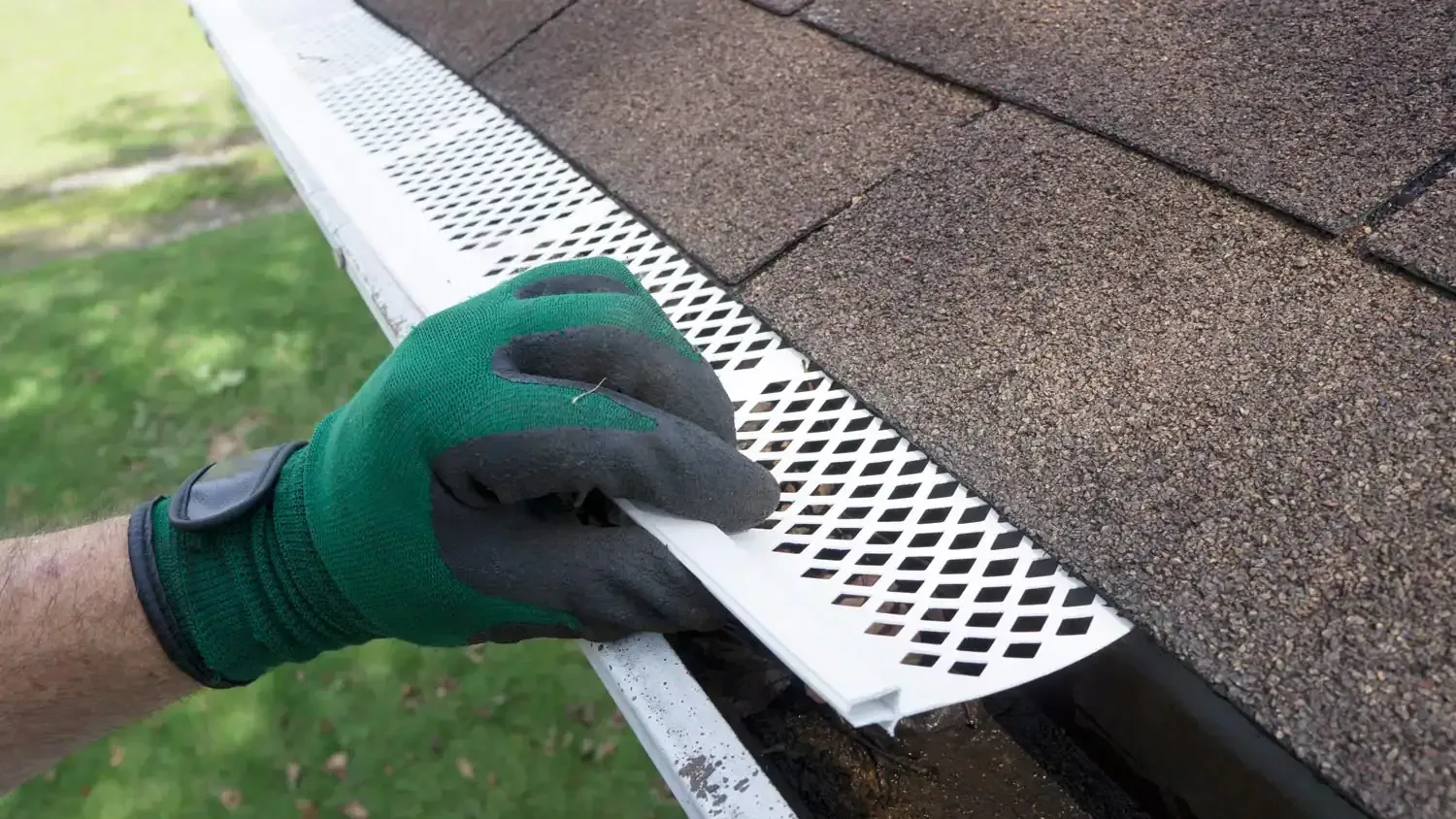 An image showcasing the installation process of a gutter guard system.