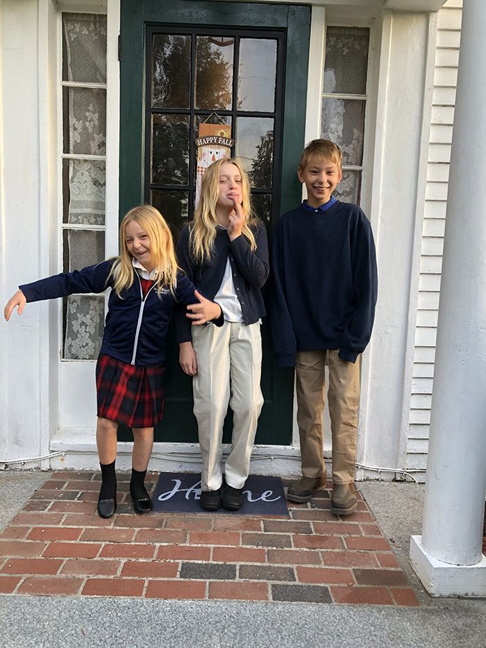 kids in front of a door