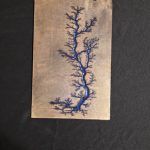 Blue Lichtenberg figure on a wooden plank.