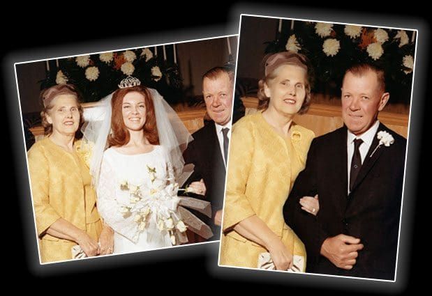 A bride and groom pose with their parents on their wedding day