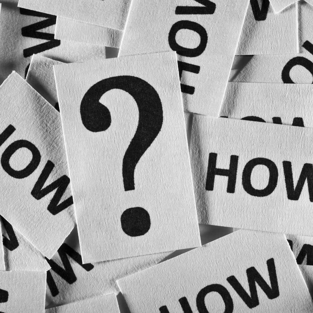 A pile of cards with the word how on them