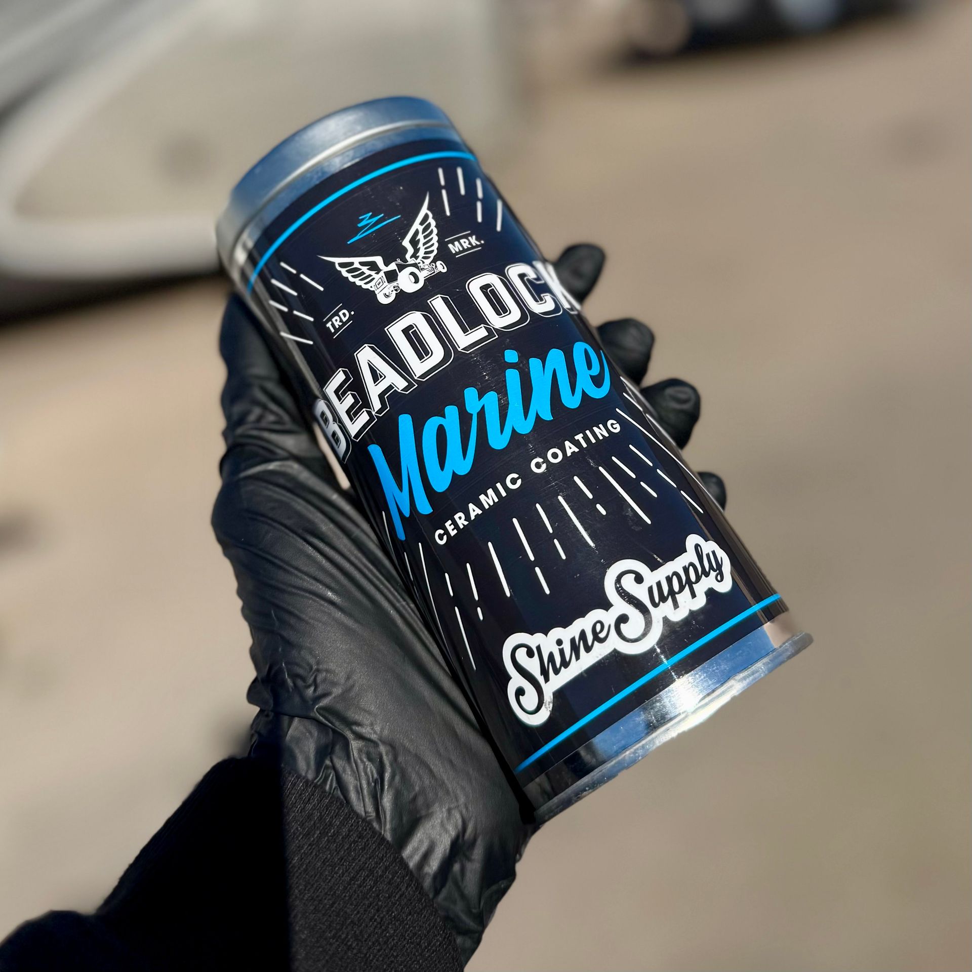 A person in a black glove holding a 