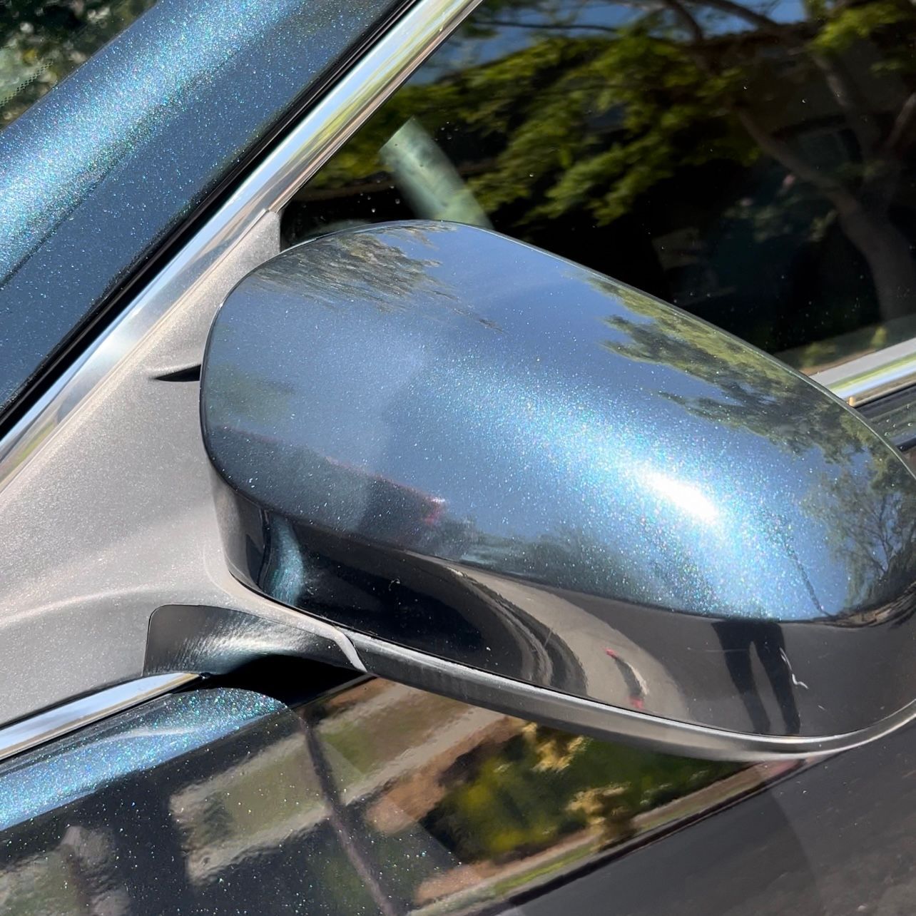 A close up of a side view mirror on a car